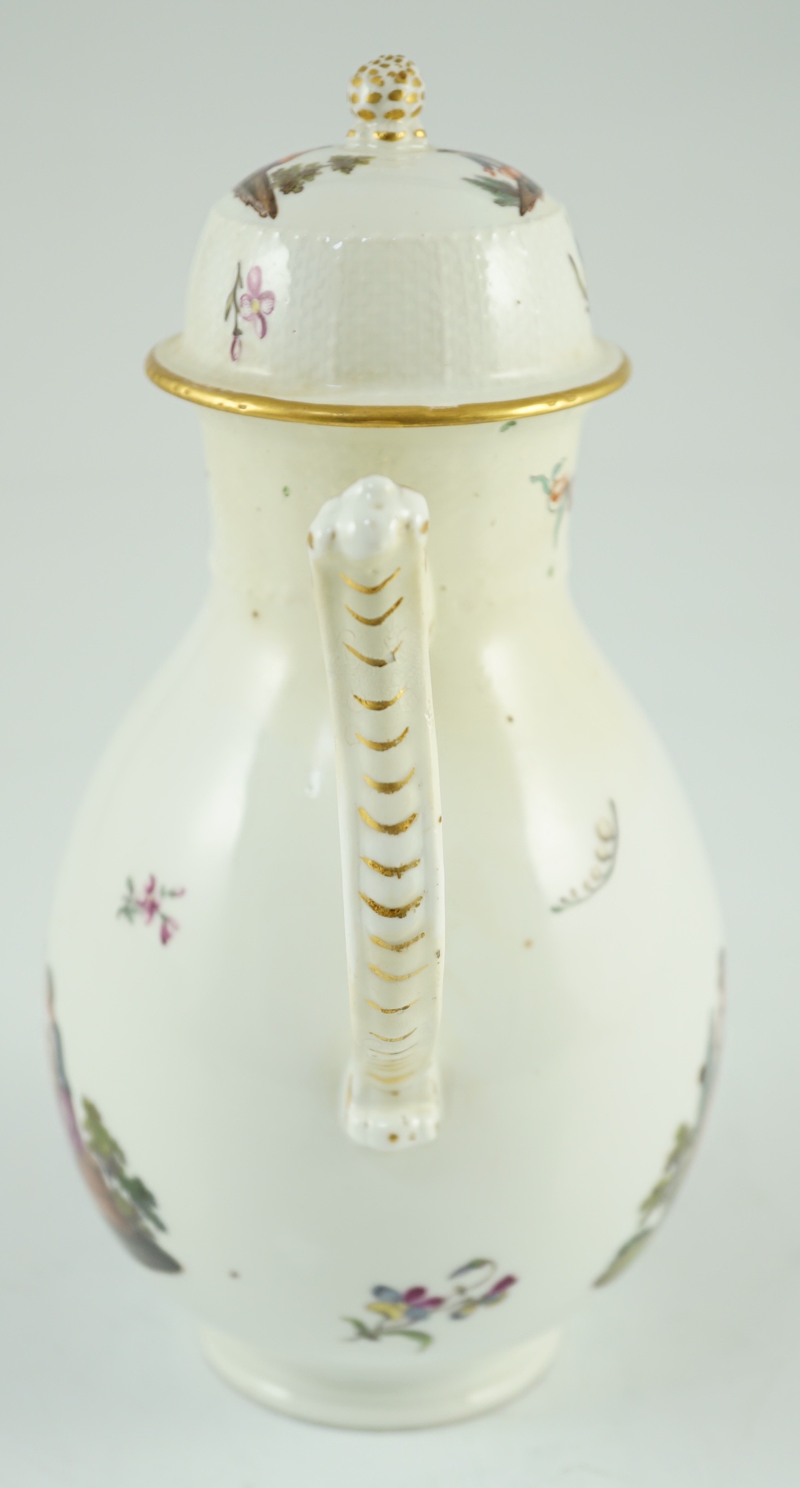 A Meissen coffee pot and cover, c.1760, 23cm high, discoloured restoration